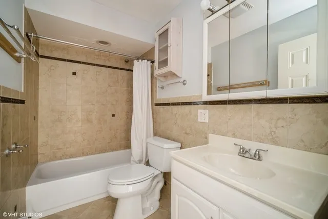 a bathroom with a sink a toilet and a bathtub