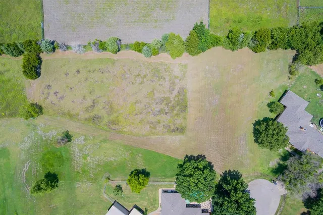 a view of a lake with a yard