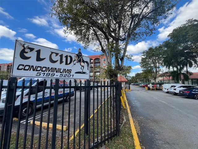 a view of a street with cars