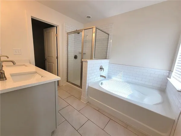 a bathroom with a bathtub and a sink