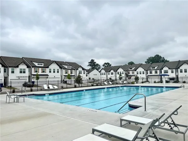 a view of a yard with a swimming pool