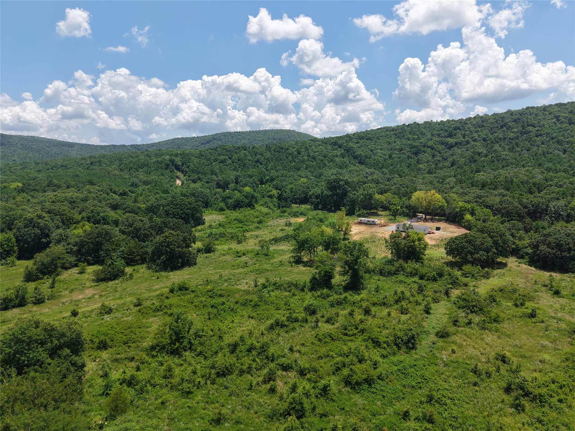 33594 Johnson Shady Point Shady Point, OK 74956 - Photo 15 of 18 Expansive land featuring lush green foliage and distant mountains