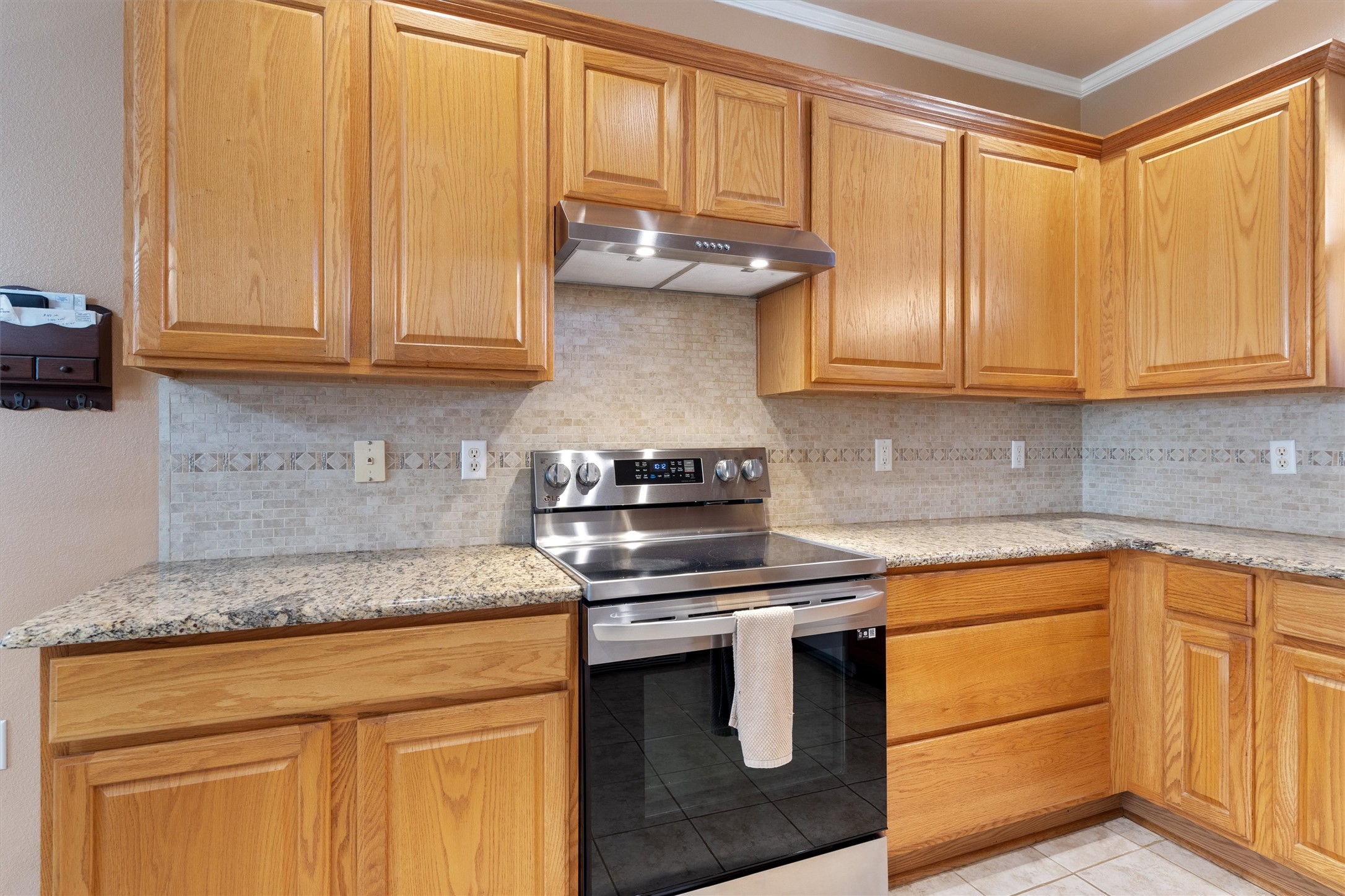 272 Red Poppy Trail Georgetown, TX 78633 - Photo 12 of 29 a kitchen with stainless steel appliances granite countertop a stove a sink and dishwasher