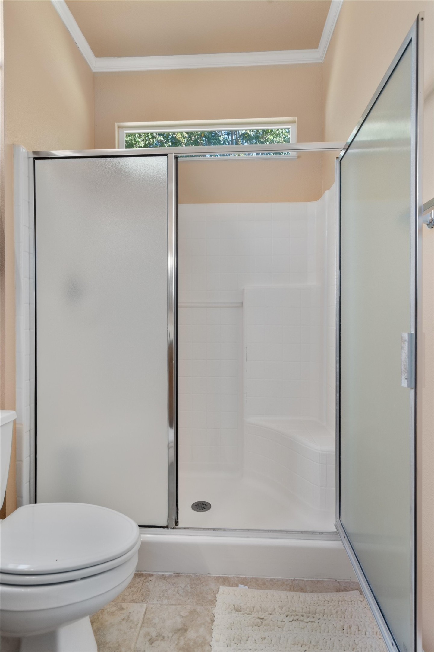 272 Red Poppy Trail Georgetown, TX 78633 - Photo 17 of 29 a bathroom with a shower a toilet and a glass window