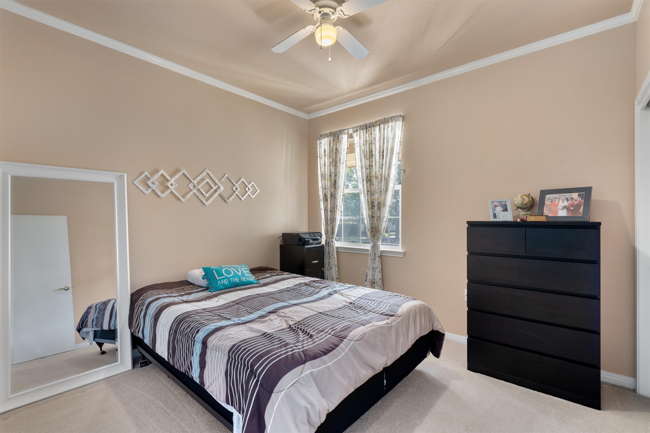 272 Red Poppy Trail Georgetown, TX 78633 - Photo 19 of 29 a bedroom with a bed and a dresser