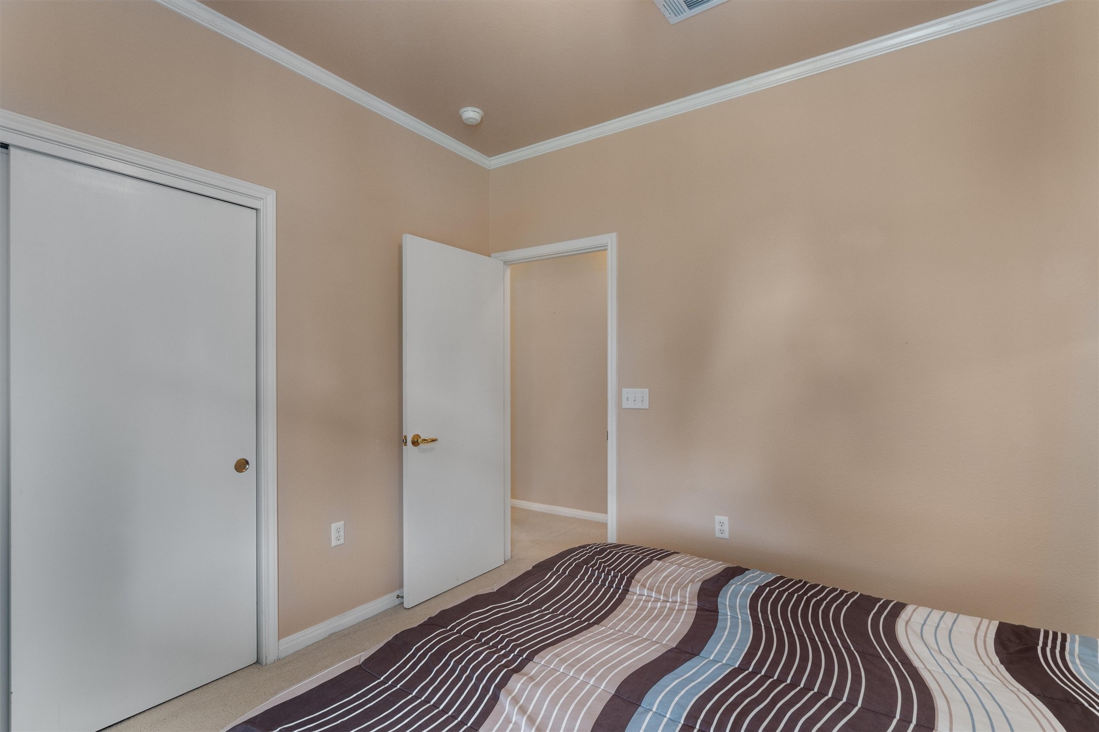 272 Red Poppy Trail Georgetown, TX 78633 - Photo 20 of 29 a bedroom with a bed and wooden floor