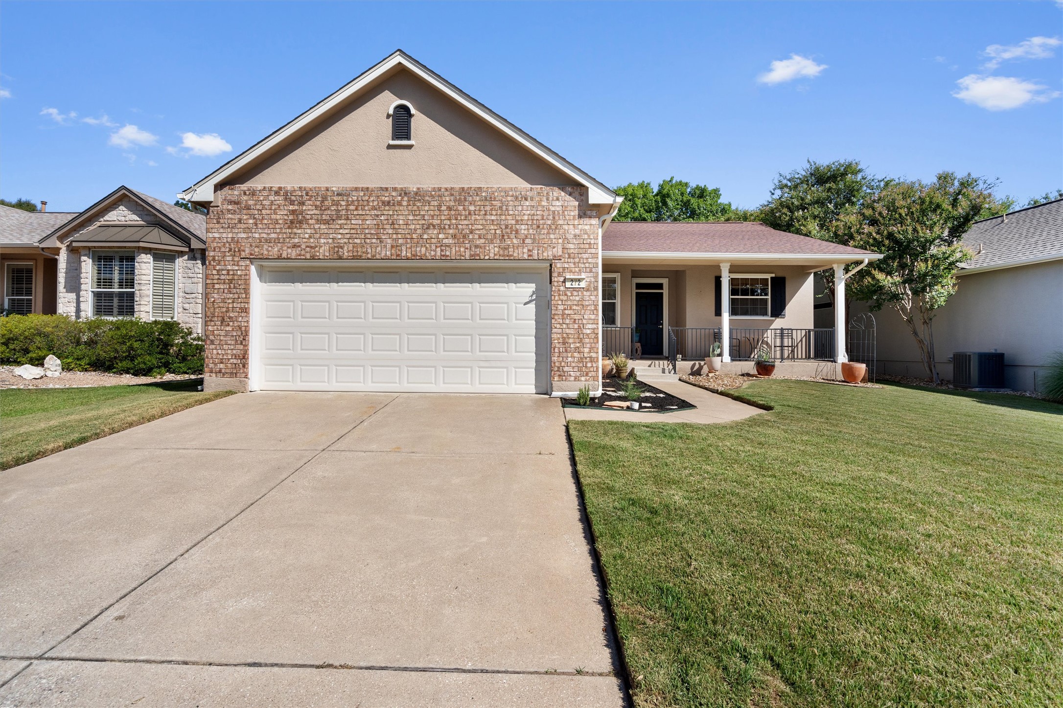 272 Red Poppy Trail Georgetown, TX 78633 - Photo 2 of 29 a front view of a house with a yard and garage