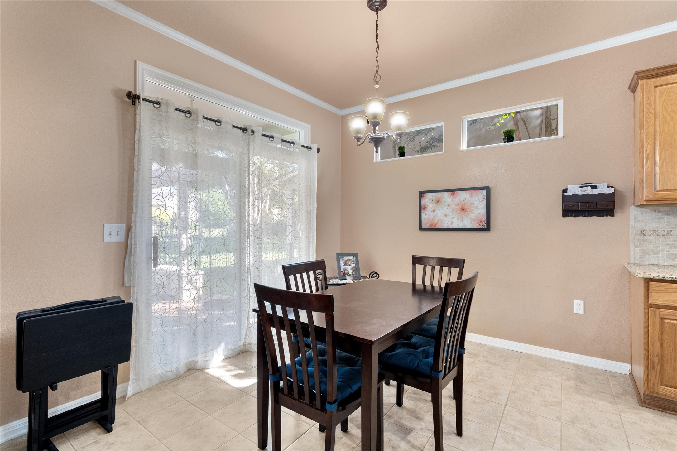 272 Red Poppy Trail Georgetown, TX 78633 - Photo 9 of 29 a view of a dining room with furniture large window and wooden floor