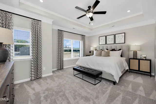 a spacious bedroom with a bed and a window