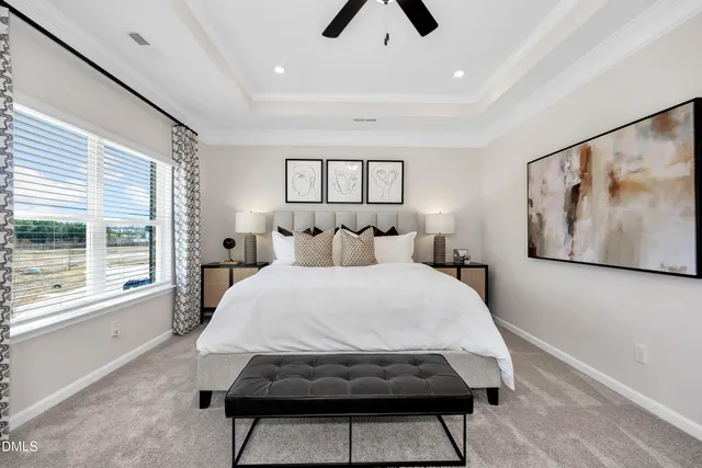 a bedroom with a bed and a painting on the wall