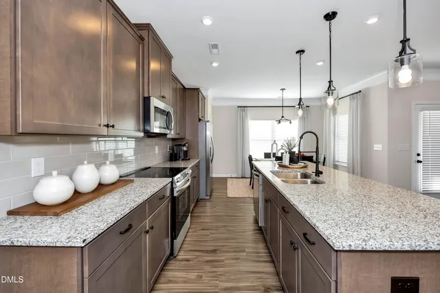 a kitchen with granite countertop counter space a sink and cabinets