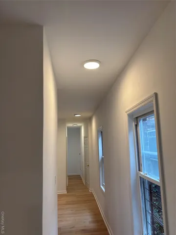 a view of hallway with livingroom