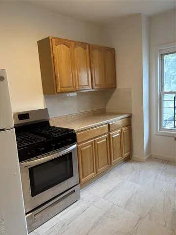 a kitchen with a stove and a cabinet