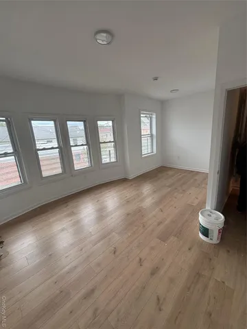 a view of livingroom with hardwood floor and hallway