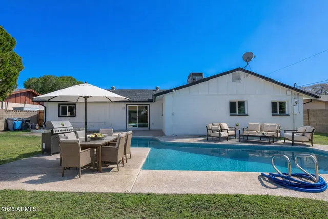 a patio with table and chairs