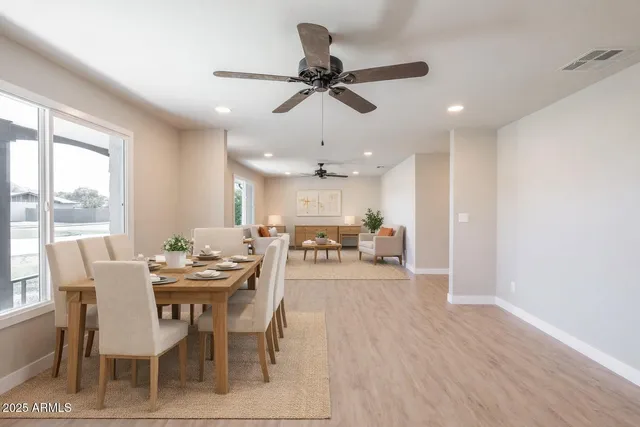 a view of a dining room with furniture window and wooden floor