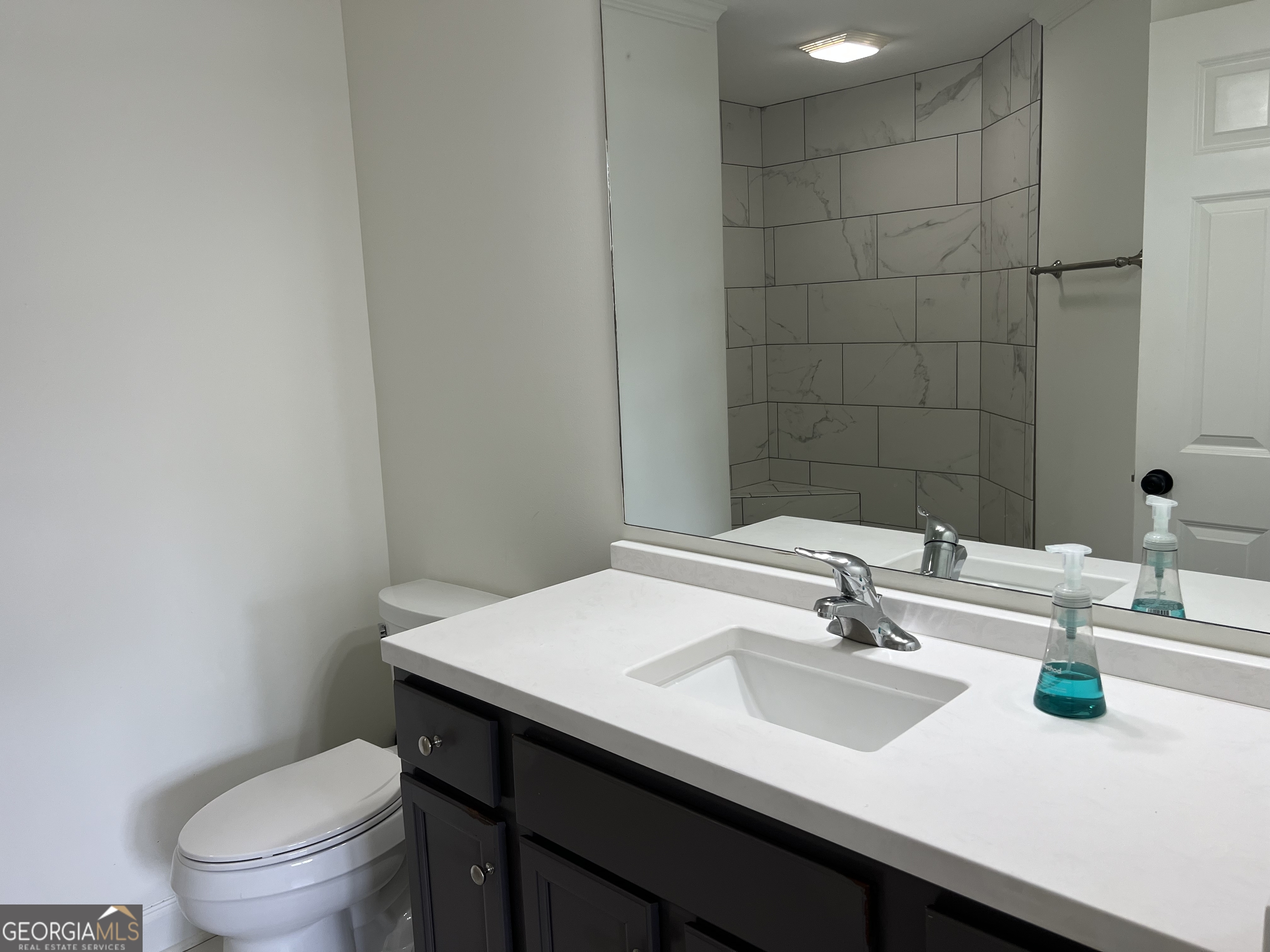 166 Montego Bay Road Northwest Milledgeville, GA 31061 - Photo 13 of 42 a bathroom with a sink a toilet and mirror