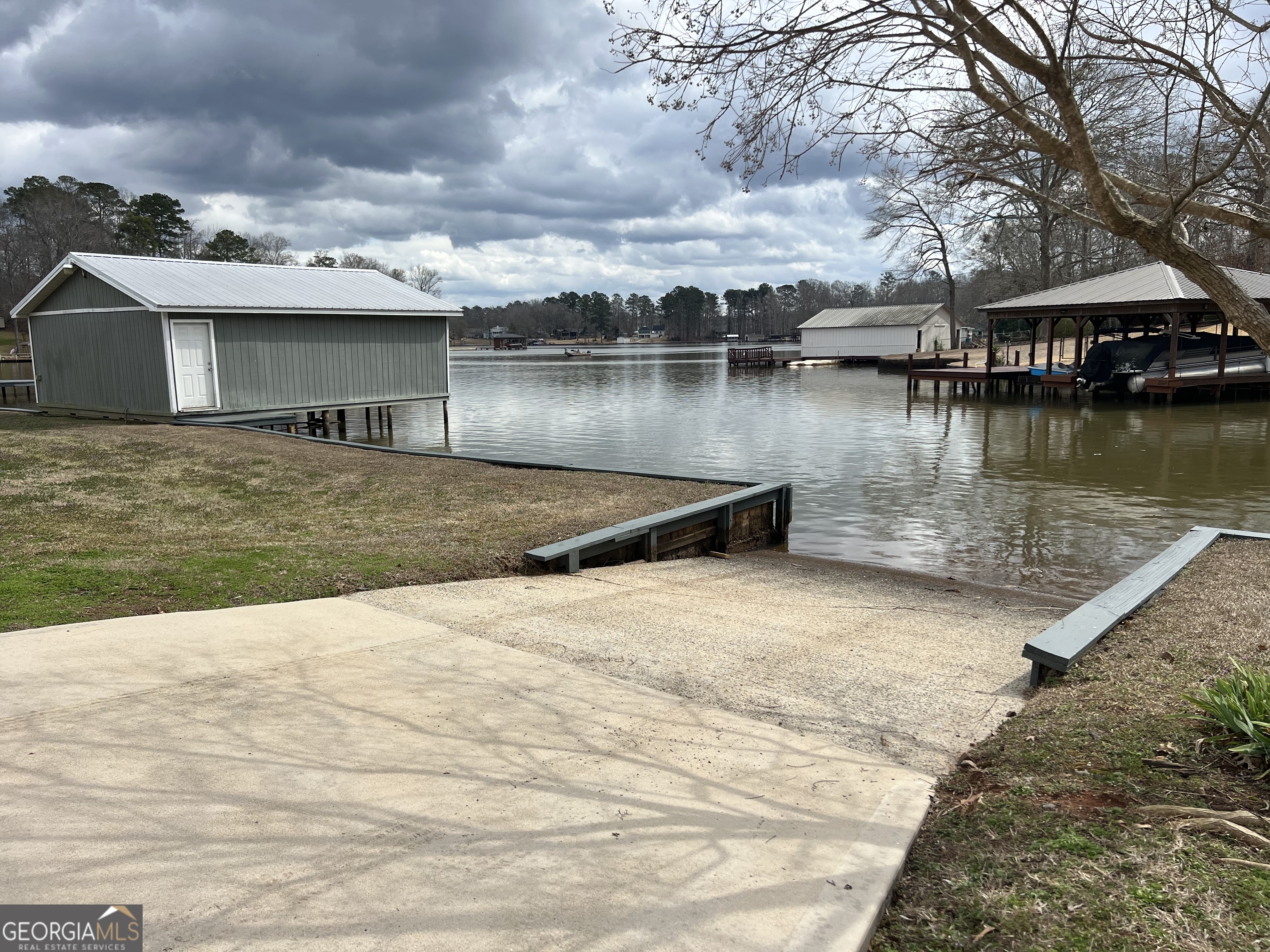 166 Montego Bay Road Northwest Milledgeville, GA 31061 - Photo 30 of 42 a view of a house with a yard and lake view
