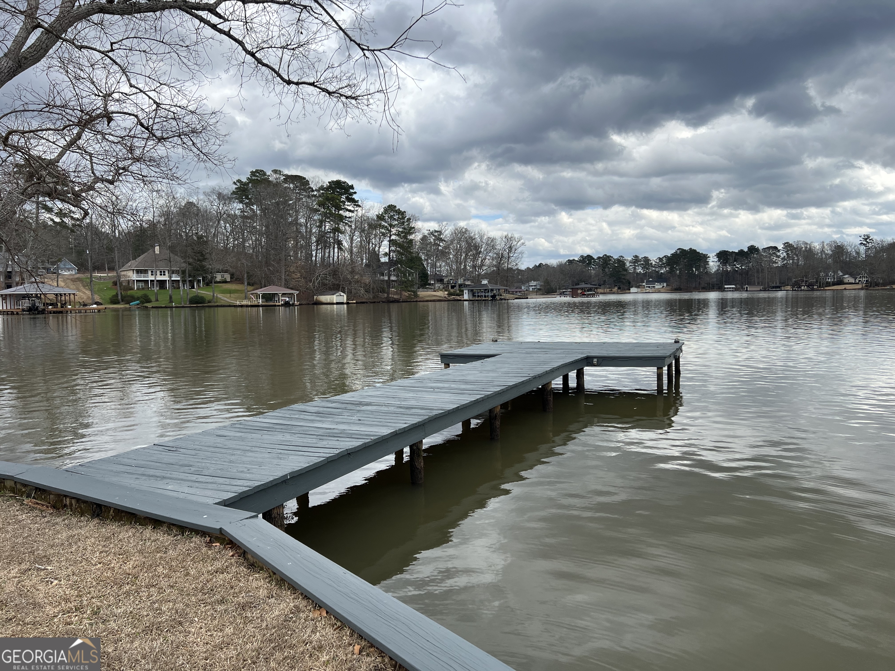 166 Montego Bay Road Northwest Milledgeville, GA 31061 - Photo 37 of 42 a view of a lake with houses in the background