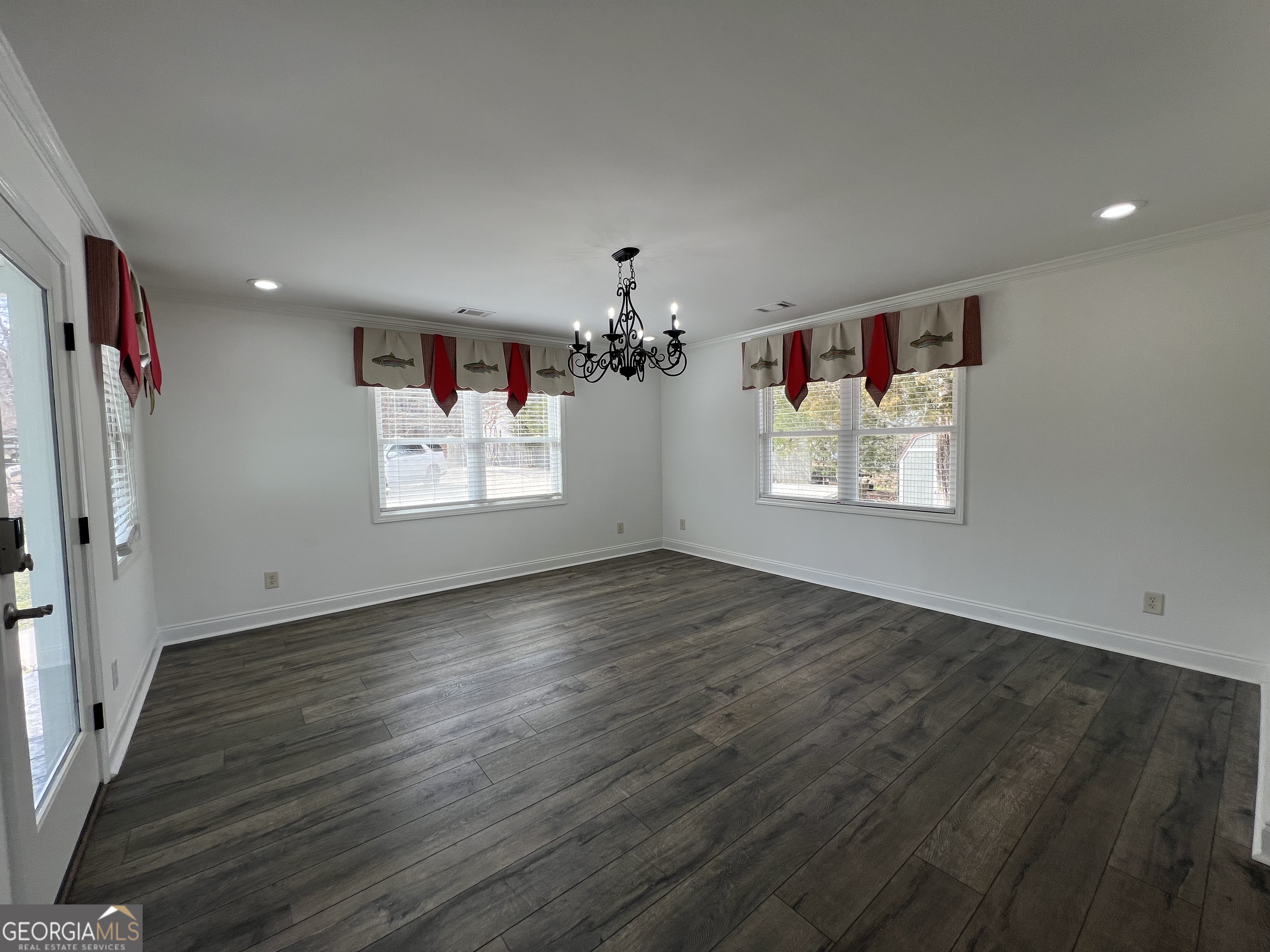 166 Montego Bay Road Northwest Milledgeville, GA 31061 - Photo 4 of 42 wooden floor in an empty room with a window