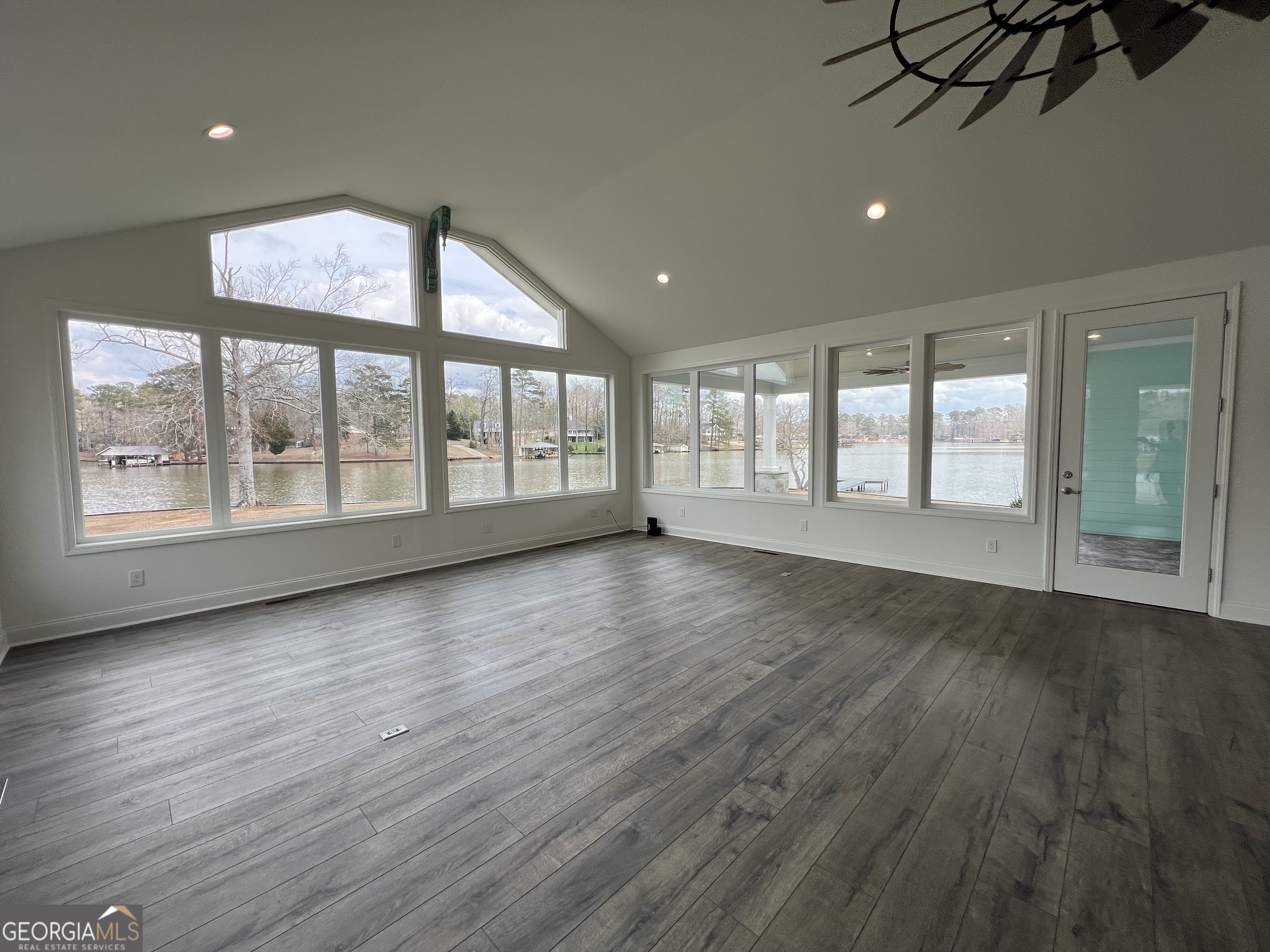 166 Montego Bay Road Northwest Milledgeville, GA 31061 - Photo 10 of 42 an empty room with wooden floor and windows