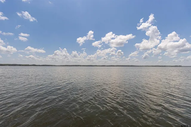 a white bath tub sitting next to a white toilet