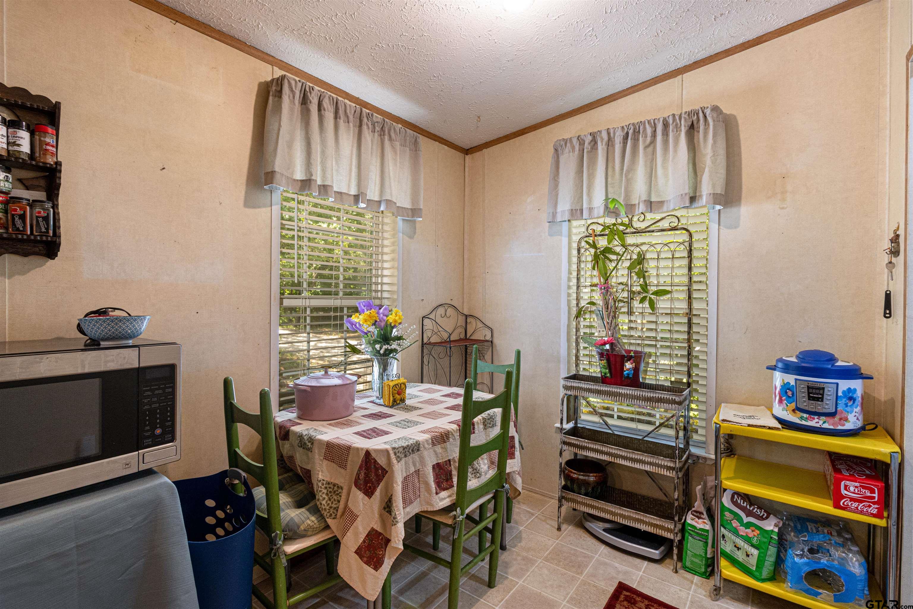 489 Martha Street Bullard, TX 75757 - Photo 22 of 44 a dining room with furniture and a window