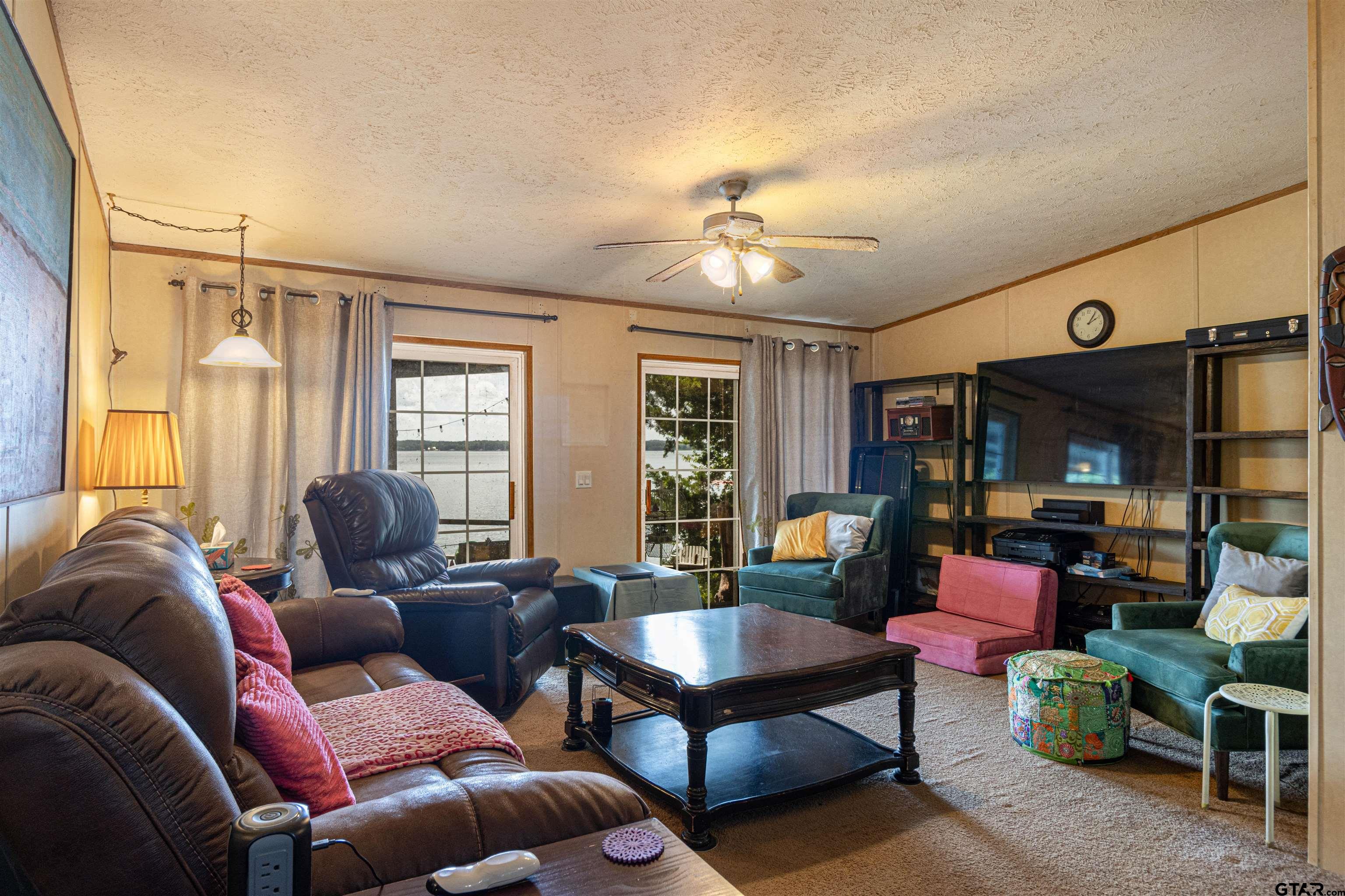 489 Martha Street Bullard, TX 75757 - Photo 25 of 44 a living room with furniture ceiling fan and a window
