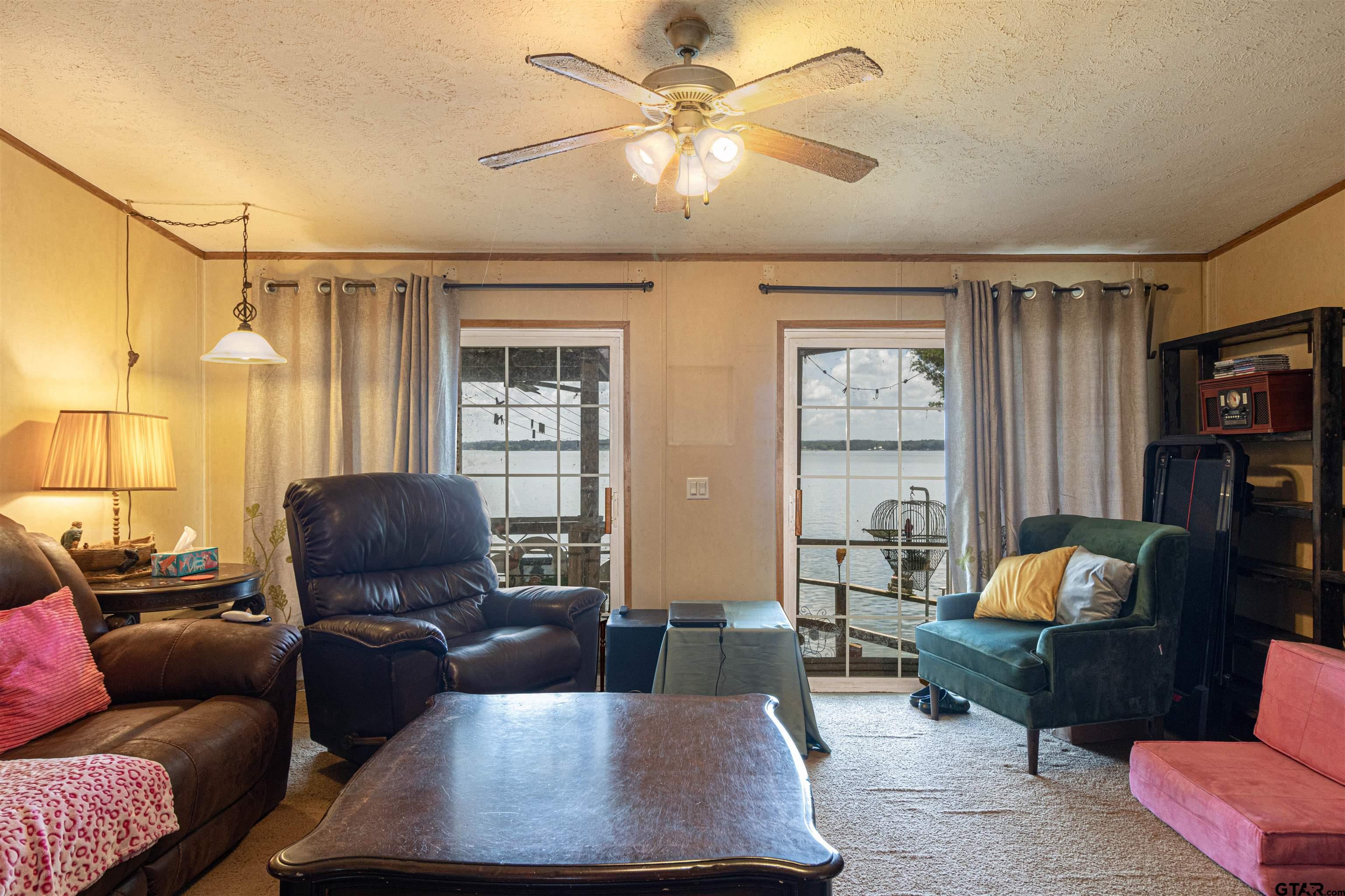 489 Martha Street Bullard, TX 75757 - Photo 26 of 44 a living room with furniture ceiling fan and a window