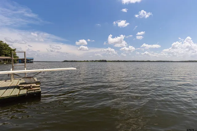 a kitchen with stainless steel appliances a refrigerator a stove a sink and a refrigerator