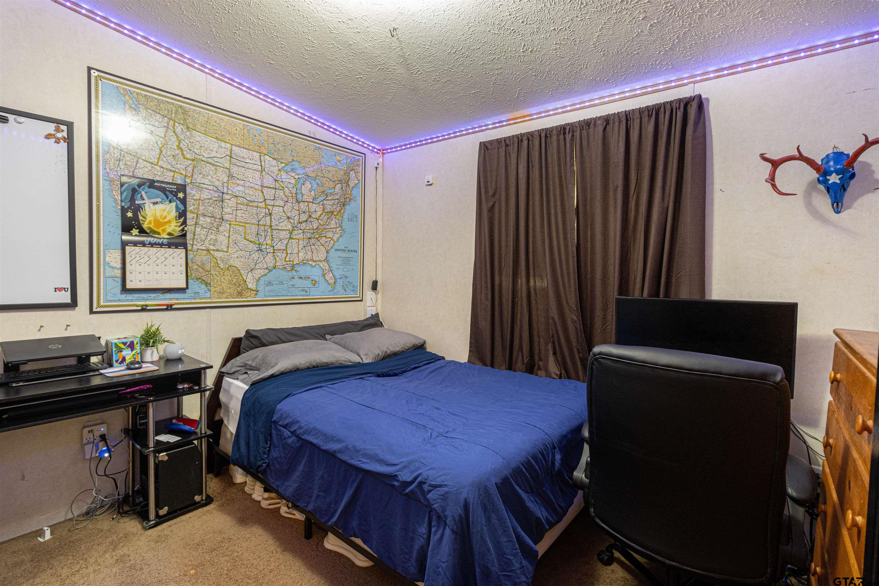 489 Martha Street Bullard, TX 75757 - Photo 34 of 44 a bedroom with a bed and a dresser