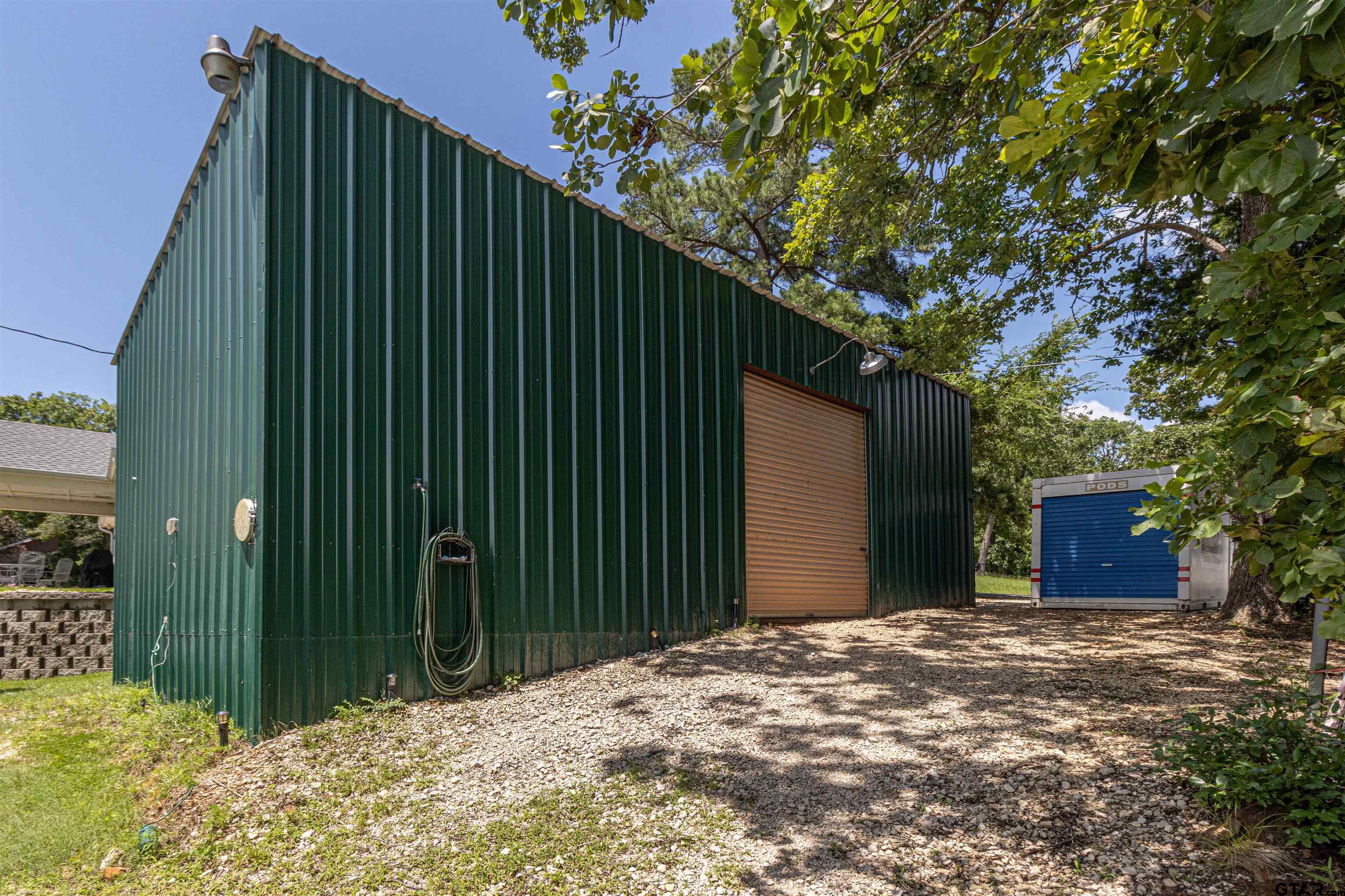 489 Martha Street Bullard, TX 75757 - Photo 38 of 44 a view of a house with a plants and wooden fence