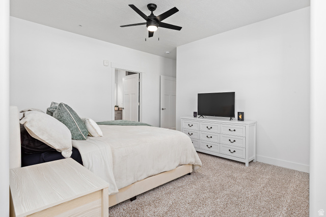 4735 Alder Drive, Unit F101 Mapleton, UT 84664 - Photo 15 of 30 Bedroom with light carpet and ceiling fan