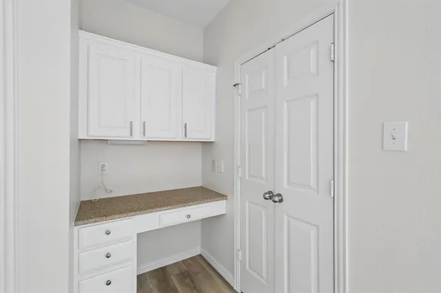 a view of empty room with windows