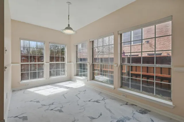 a view of empty room with windows