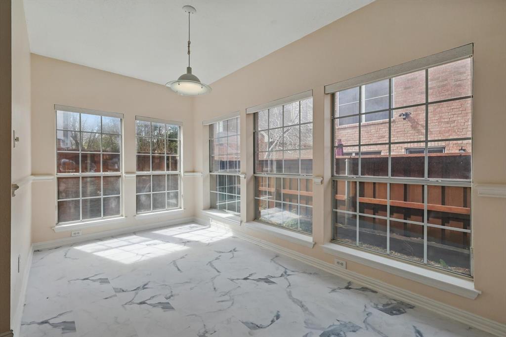 14625 Windsor Court Addison, TX 75001 - Photo 17 of 40 a view of empty room with windows