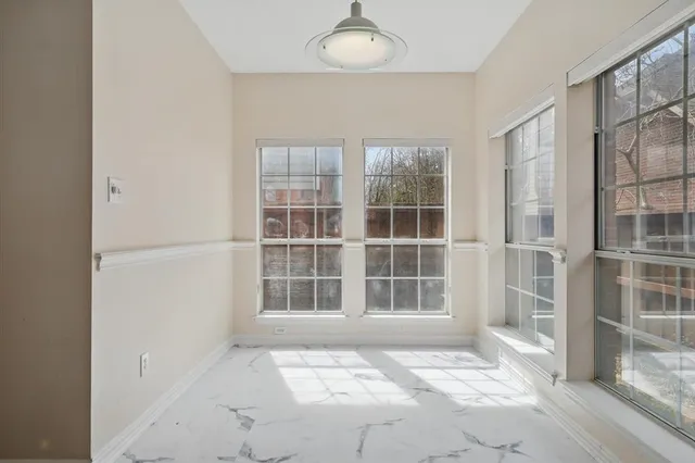 a view of a big room with closet and windows
