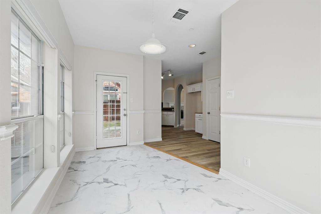 14625 Windsor Court Addison, TX 75001 - Photo 19 of 40 a view of a big room with closet and windows