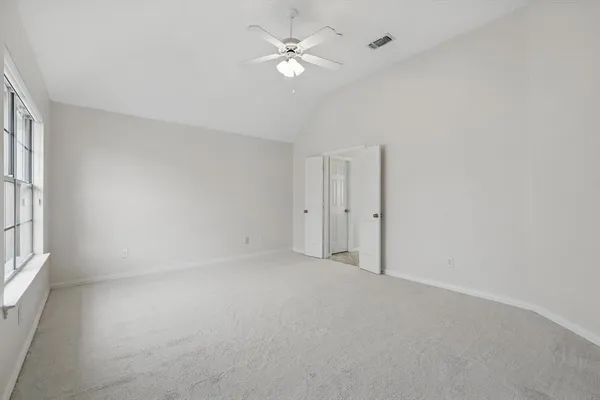 a view of an empty room with a window