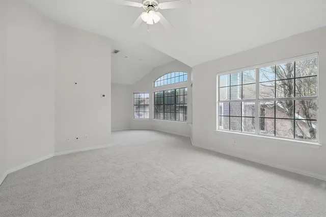 a spacious bathroom with sink shower and a bathtub