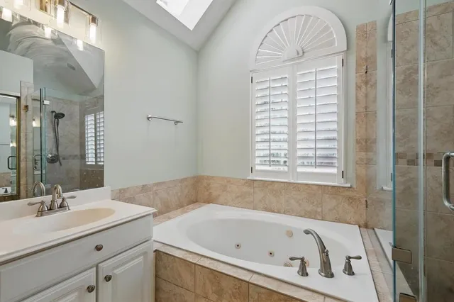 a bathroom with a sink double vanity and a mirror