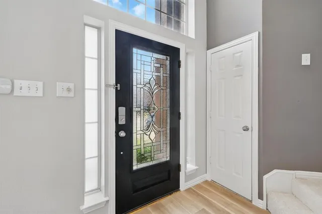 a view of a bedroom from the hallway