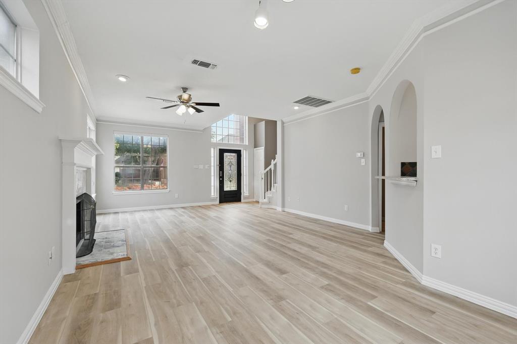 14625 Windsor Court Addison, TX 75001 - Photo 9 of 40 wooden floor in an empty room with a window