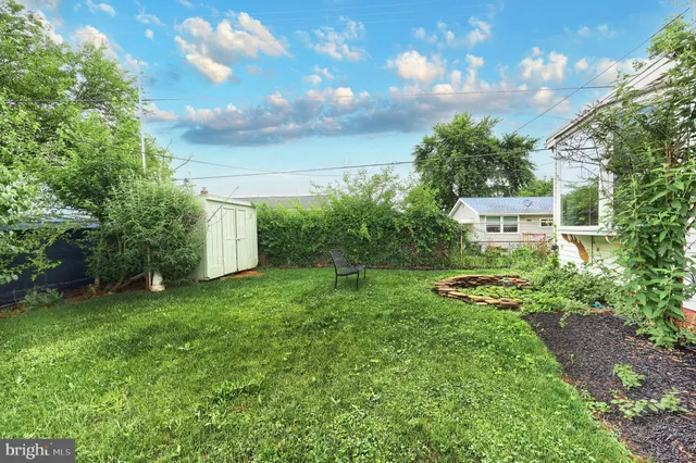 a view of a garden with a building in the background