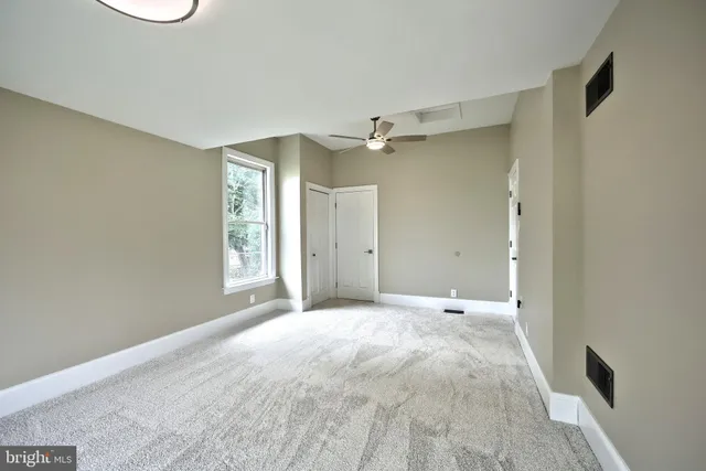 a view of room with wooden floor