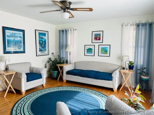 a living room with furniture and a rug