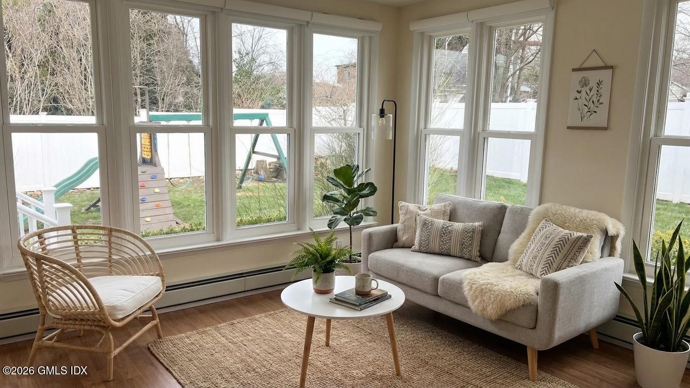 45 Sound Beach Ave Extension Riverside, CT 06878 - Photo 10 of 11 a living room with furniture and a large window