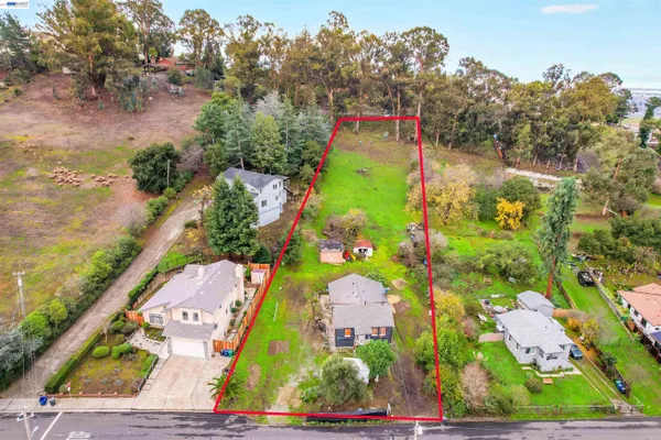 an aerial view of residential house with outdoor space