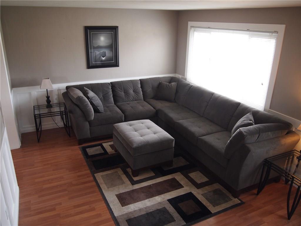 936 Lindsay Road Carnegie, PA 15106 - Photo 2 of 25 New window, wainscoting, laminate floors gives this living room a fresh new look.