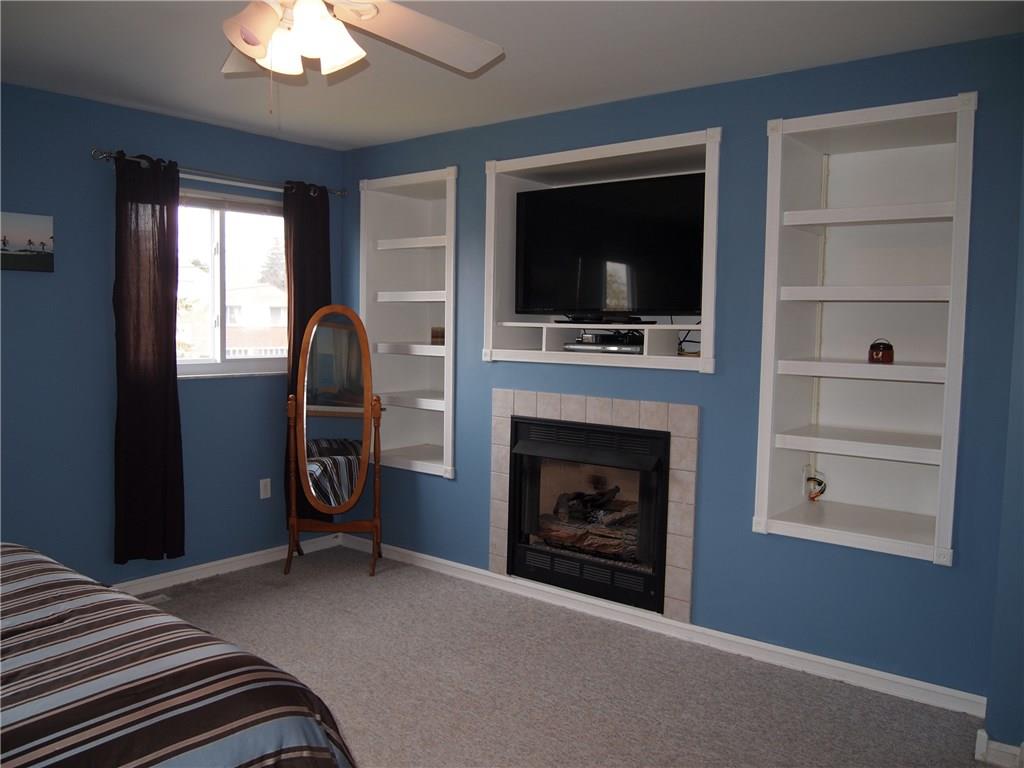 936 Lindsay Road Carnegie, PA 15106 - Photo 11 of 25 Added functionality with built ins and romantic gas fireplace. Plenty of space for additional seating.